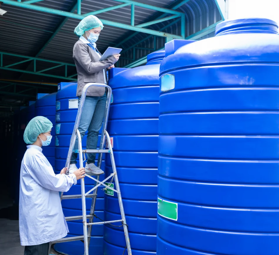 Servicing a high-rise building's central system for apartment water tank cleaning in Dubai